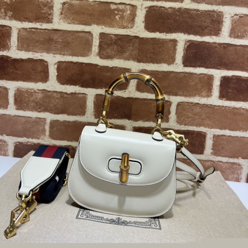 G*u*i top handle bags